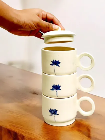 These stackable mugs feature a delicate, hand-painted blue lotus design. Their space-saving functionality makes them as practical as they are beautiful, and I am currently accepting pre-orders for this set.