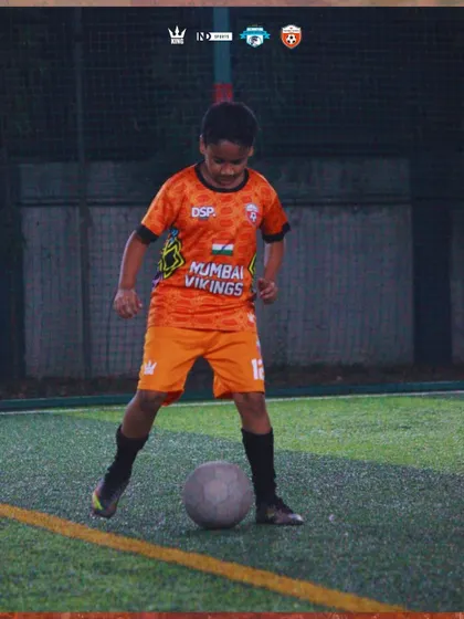 A young warrior with the ball at his feet. We focus on building comfort and confidence on the ball from day one.