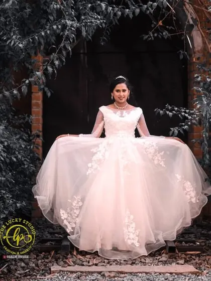 A solo portrait of the bride-to-be in her elegant white rental gown. The makeup is kept soft and timeless, with a focus on radiant skin and defined eyes.