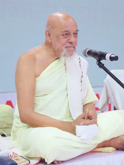 A revered spiritual leader addresses the audience from the stage. We hold deep respect for the events we manage and ensure all arrangements are made with sensitivity and care.