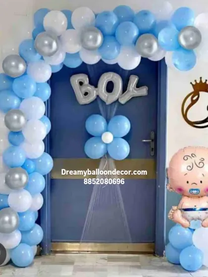 I can decorate the entrance to your home to make the baby's arrival special. This door decoration for a baby boy includes a blue, white, and silver balloon arch, a "BOY" foil balloon, and a cute baby foil balloon character.