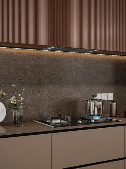 Detail of the fluted texture on the upper cabinets paired with a durable, stone-finish backsplash. These material choices add depth and character to the minimalist design.