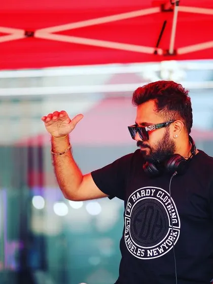 In action at an outdoor event. My focus is always on the music and the crowd, ensuring a seamless flow of energy.