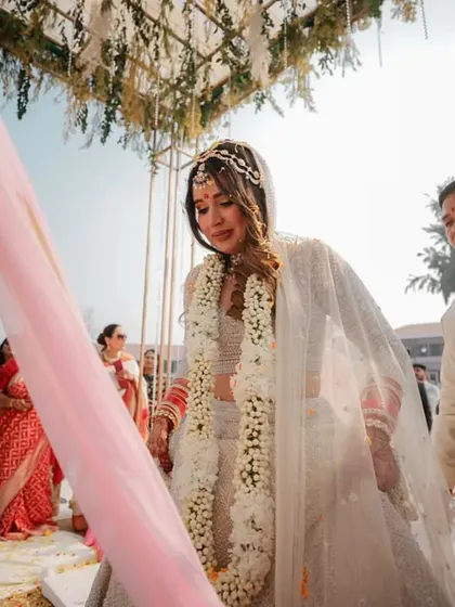 An emotional moment during the Pheras, as the bride looks down with a tear in her eye, capturing the profound feelings of the day.