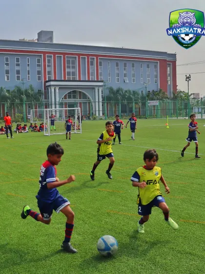 "Go for the ball." Our players follow the coach's instruction with full commitment during a practice game.