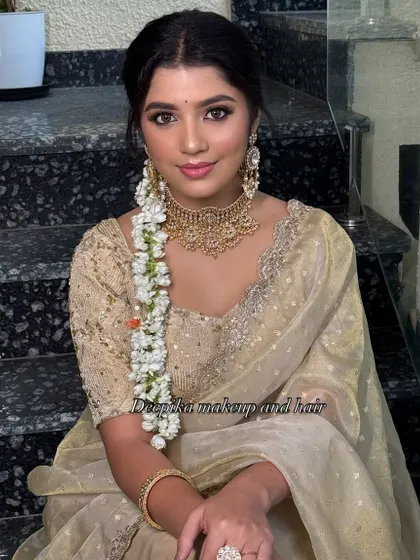 This look is all about simple, classy tradition. The soft gold saree is paired with a fresh jasmine braid and natural, elegant makeup.