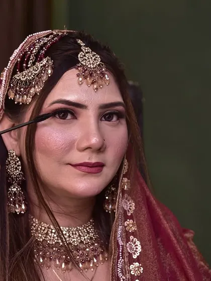 The application of mascara is a crucial step to open up the eyes. Here, I am carefully applying it to my engagement bride to complete her eye makeup.