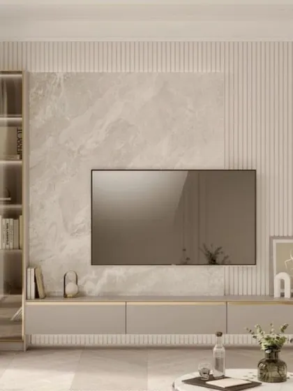 This TV unit design combines a marble-look backdrop with fluted paneling and a sleek, glass-fronted display cabinet, offering a perfect blend of texture and sophistication.
