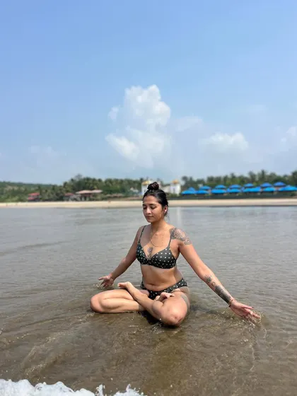 Seated in lotus pose at the water's edge, I let the waves wash over me. This is a practice of surrender and of finding stillness amidst constant motion.