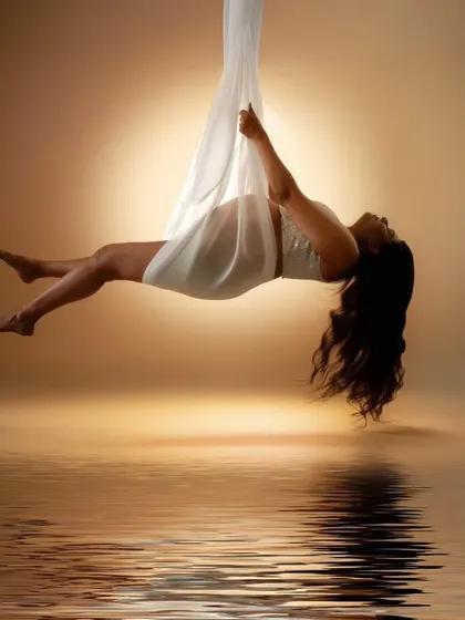 Suspended in serenity, wrapped in elegance. This shot speaks of strength, grace, and the ethereal journey of motherhood.