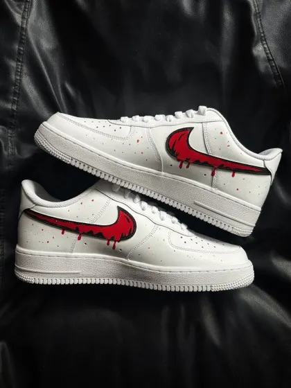 A top-down view of the red drip custom sneakers.