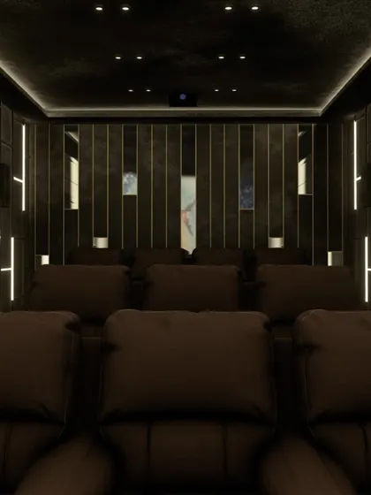 The front view of this theater, showing the symmetrical placement of speakers and the impressive screen, ready for a movie.