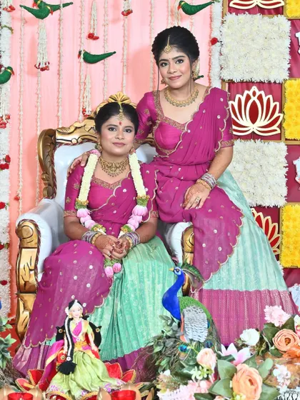 Nothing makes me happier than dressing sisters for their special moments. I designed these matching turquoise and purple Langa Voni outfits for a half saree function, ensuring they both looked coordinated yet unique.