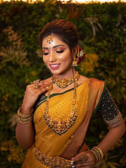 The full view of a traditional bridal look, complete with saree and temple jewelry. Students learn how to style a bride from head to toe.