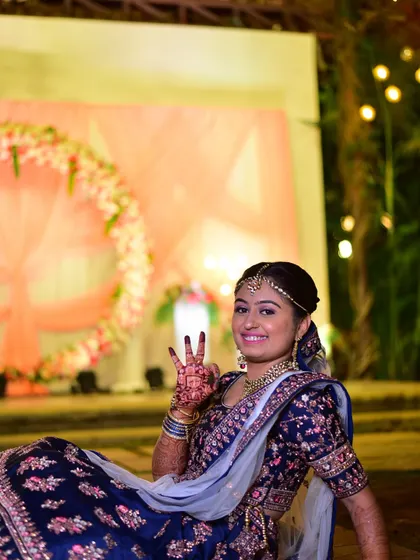 A happy bride posing during her reception. Her smile says it all.