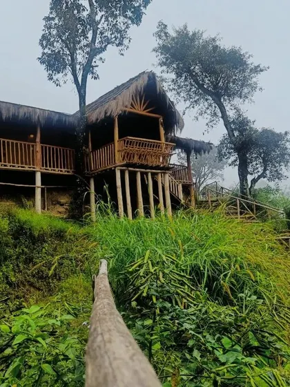The Vattavada mud house perched on the hillside, offering stunning views and a peaceful retreat.