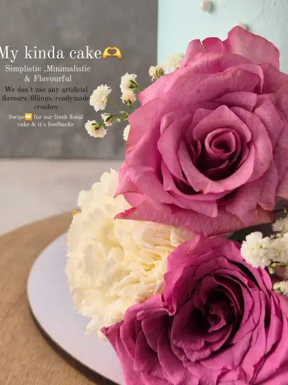A close-up of the fresh roses on the pastel blue "Estate Social" cake. I love working with fresh flowers.