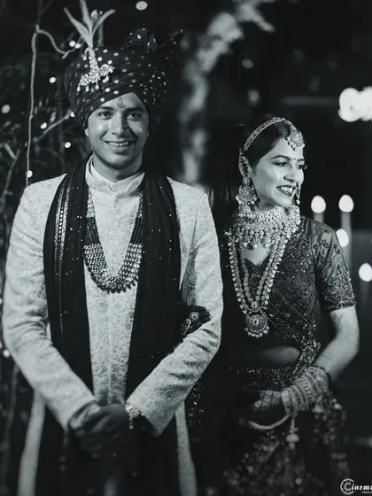 A happy, candid black and white portrait of the wedding couple. This style strips away distractions and focuses on their joyful connection.