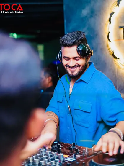 A happy, smiling shot of me at Toca. I genuinely love what I do, and it shows.