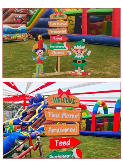 Fun directional signposts are a great way to guide guests and add to the theme. These signs for a Christmas carnival point the way to the flea market, amusement rides, food, and games.