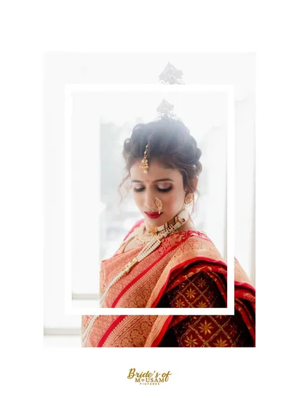 A high-contrast, artistic portrait of a bride in a traditional silk saree. The bright lighting and clean composition make this a striking and modern take on a classic bridal look.