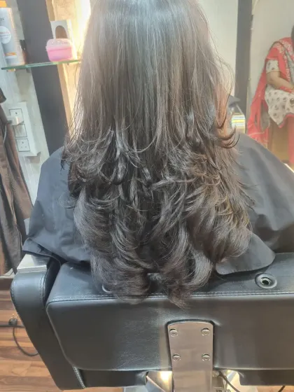 A gallery of finished haircuts, showing the beautiful layers and shape from the back. You can see the volume and texture each cut creates.