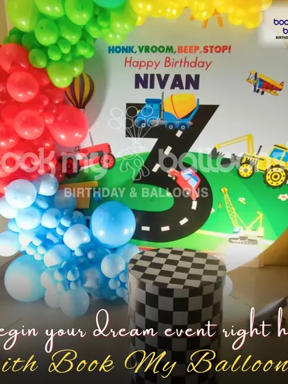 Honk, vroom, beep, stop. Nivan's third birthday was all about things that go. This transportation theme featured cars, trucks, and planes on a custom backdrop with a road design, surrounded by a colorful balloon garland.