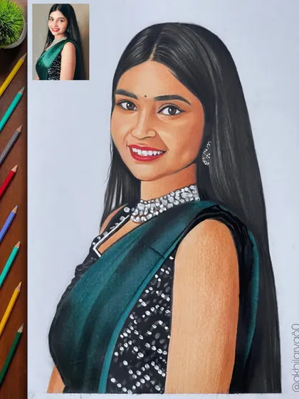 A beautiful A3 colored pencil portrait of a woman in a green saree. The detailed necklace and the smile make this a very engaging piece.