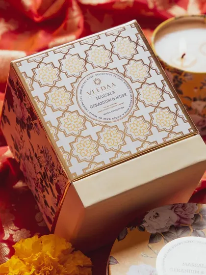 A look at the beautiful gift box for our Marsala Geranium & Musk tin candle. The entire package is designed to be a luxurious and festive treat.