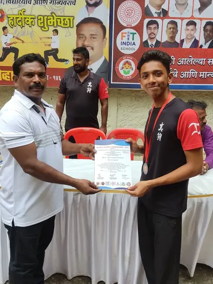 Another one of my students being recognized for his performance in the long stick fighting competition.
