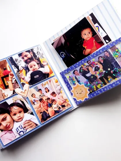 A collage page filled with family photos and a fun shaker window to celebrate a little one's special moments.