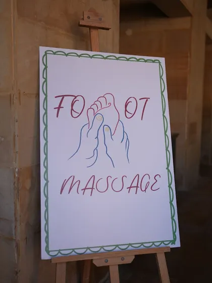 A sign for the foot massage station at our 'Revival Lunch.' We believe recovery should be just as enjoyable as the party.
