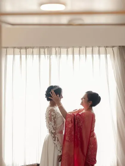 A mother's blessing for her daughter, the bride, just before the Catholic wedding ceremony.