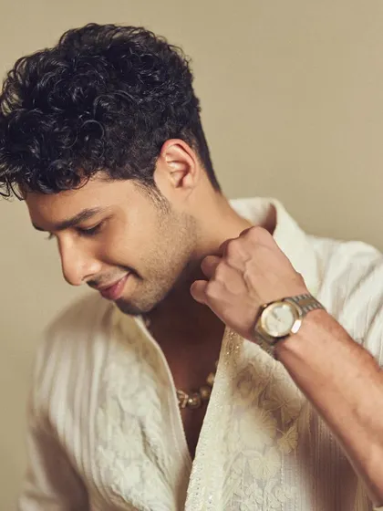 This shot highlights the delicate embroidery on the neckline of Siddhant's kurta, a detail that adds a touch of luxury without being overpowering.