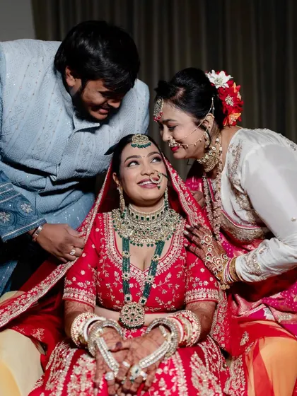 A heartwarming family moment. Bhavika's makeup is soft and pretty, ensuring she looks her best while sharing precious moments with her loved ones.