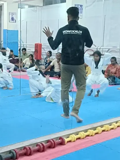 Instructors lead the class in a high-energy warm-up.