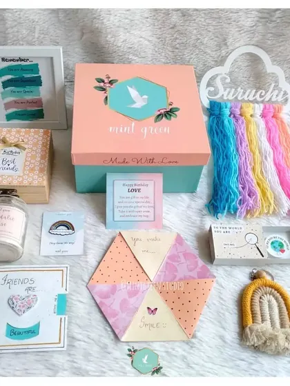 This hamper is a celebration of friendship and handmade love. It combines several of our unique crafts, including a name wall hanging, a rainbow keychain, a friendship-themed card, and a personalized memory box.