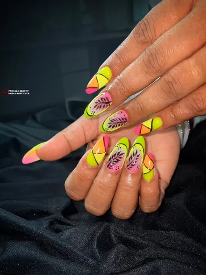 Another shot of the tropical neon nails, showing the sharp almond shape and the glossy, high-impact finish.