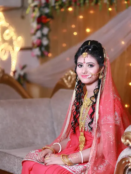 A simple and sweet bridal portrait. The bride's gentle smile is the focus, showing her happiness on the special day.