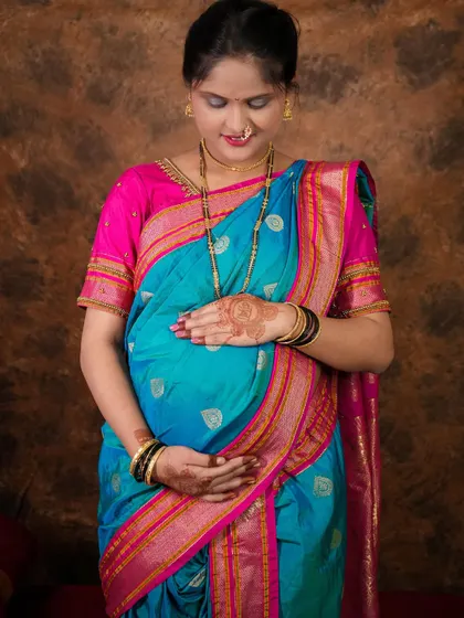My all-inclusive maternity shoot package makes everything so easy. This client is glowing in a beautiful silk saree.