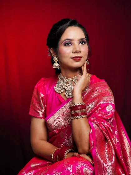 A seated portrait that exudes grace and elegance, showcasing the complete traditional ensemble.