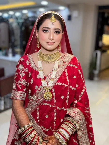 The bride looking serene and beautiful. This photo captures the soft, romantic feel of her overall look, from the makeup to the delicate jewellery.