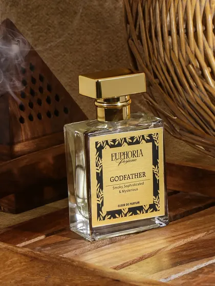 I created a rustic and masculine vibe for the 'Godfather' perfume using a wooden incense burner and a wicker basket. The rising smoke adds a layer of mystery and sophistication to this smoky fragrance.