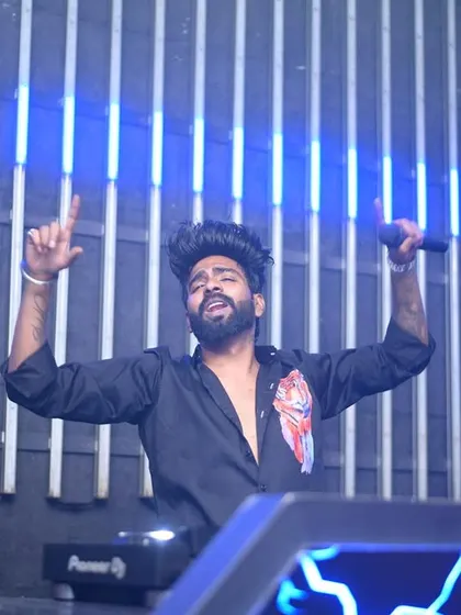 Singing along with the crowd at Carpediem Hyderabad. It's not just about playing tracks; it's about creating a collective vocal performance.