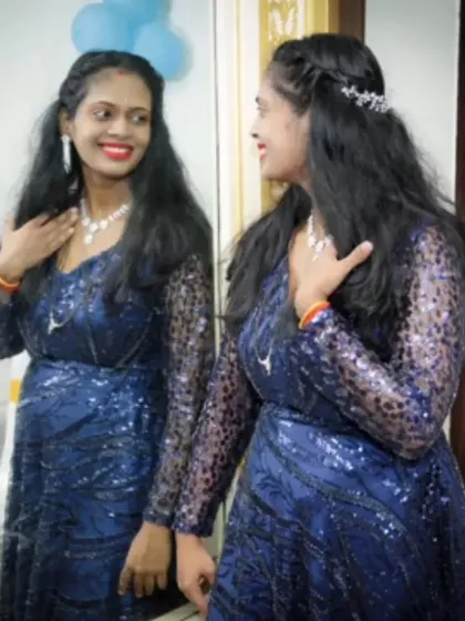 This beaded navy blue gown is a beautiful choice for a birthday or anniversary party. It comes with detachable sleeves, so you can switch between a sleeved and sleeveless look.