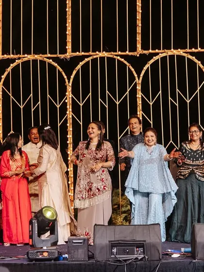 The whole family and friend group coming together for a final, joyous performance. These are the moments that make a sangeet unforgettable.
