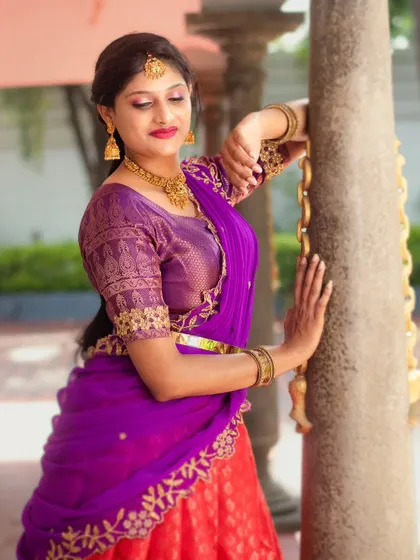 A close-up showing the beautiful embroidery on the blouse and dupatta of the half-saree.