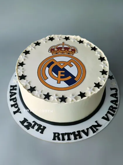 A Real Madrid logo cake for Rithvin Viraaj's 12th birthday. A simple yet classic design for a true football fan.