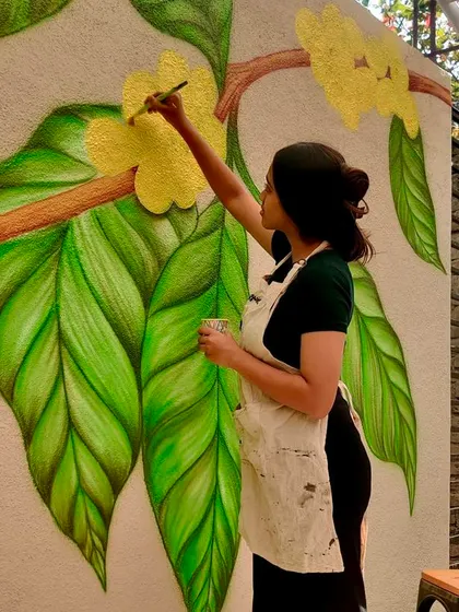 Caught in the act. Painting the fine details on a large coffee plant mural, a collaboration with Pcube Art and The Indian Circus Design.