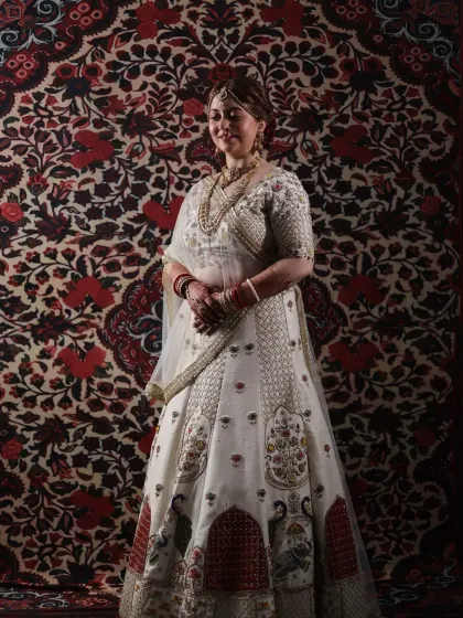 A full-length view of a stunning bridal lehenga. My job extends to ensuring the entire look is cohesive, from the makeup and hair to the way the dupatta is draped, creating a picture-perfect silhouette.